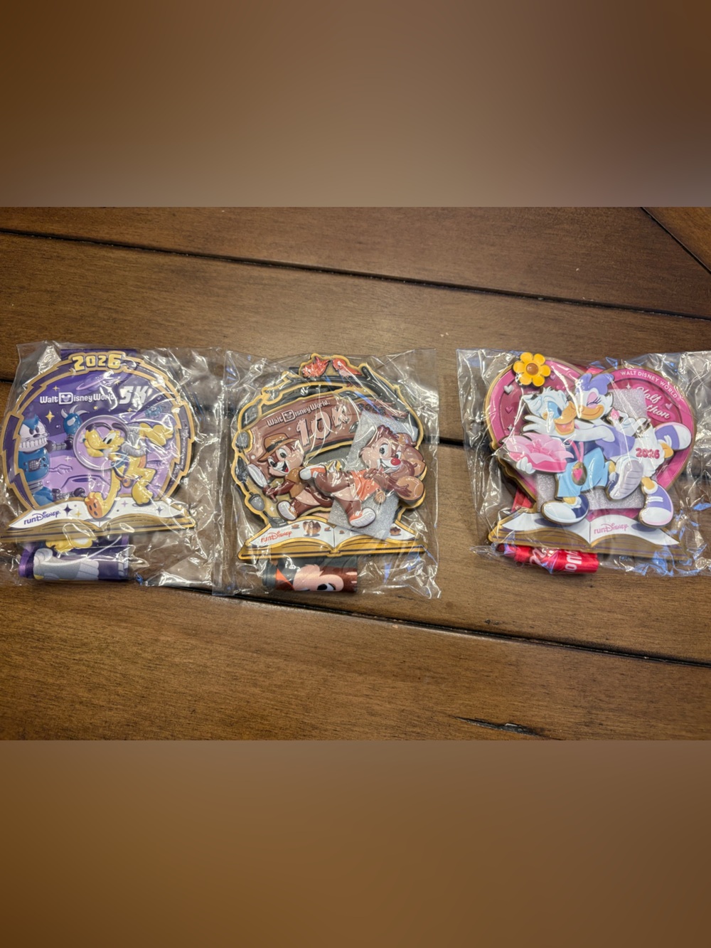 Three 2026 RunDisney Disney Purple, Brown, Pink Character medals
